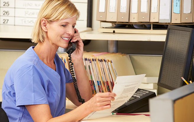 Nurse on the phone at her desk