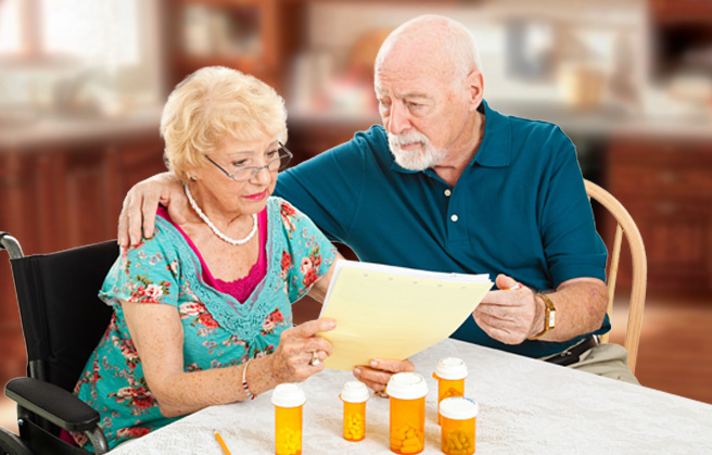 rising-medical-bills Elderly couple looking at medical bills